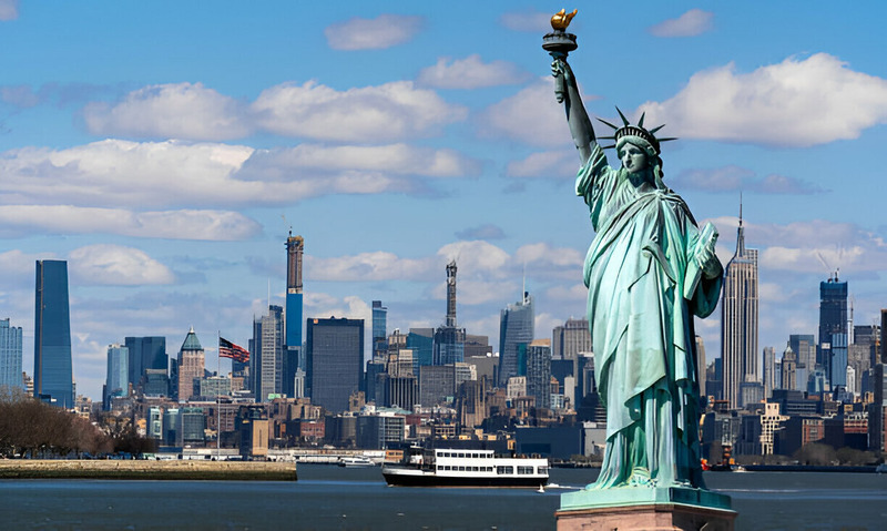 "New York City skyline featuring the Statue of Liberty and other iconic landmarks."